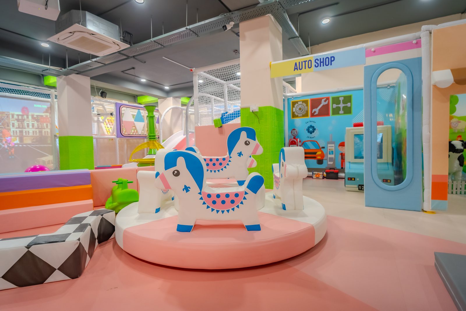 Rocking horse carousel and Auto Shop role-play corner